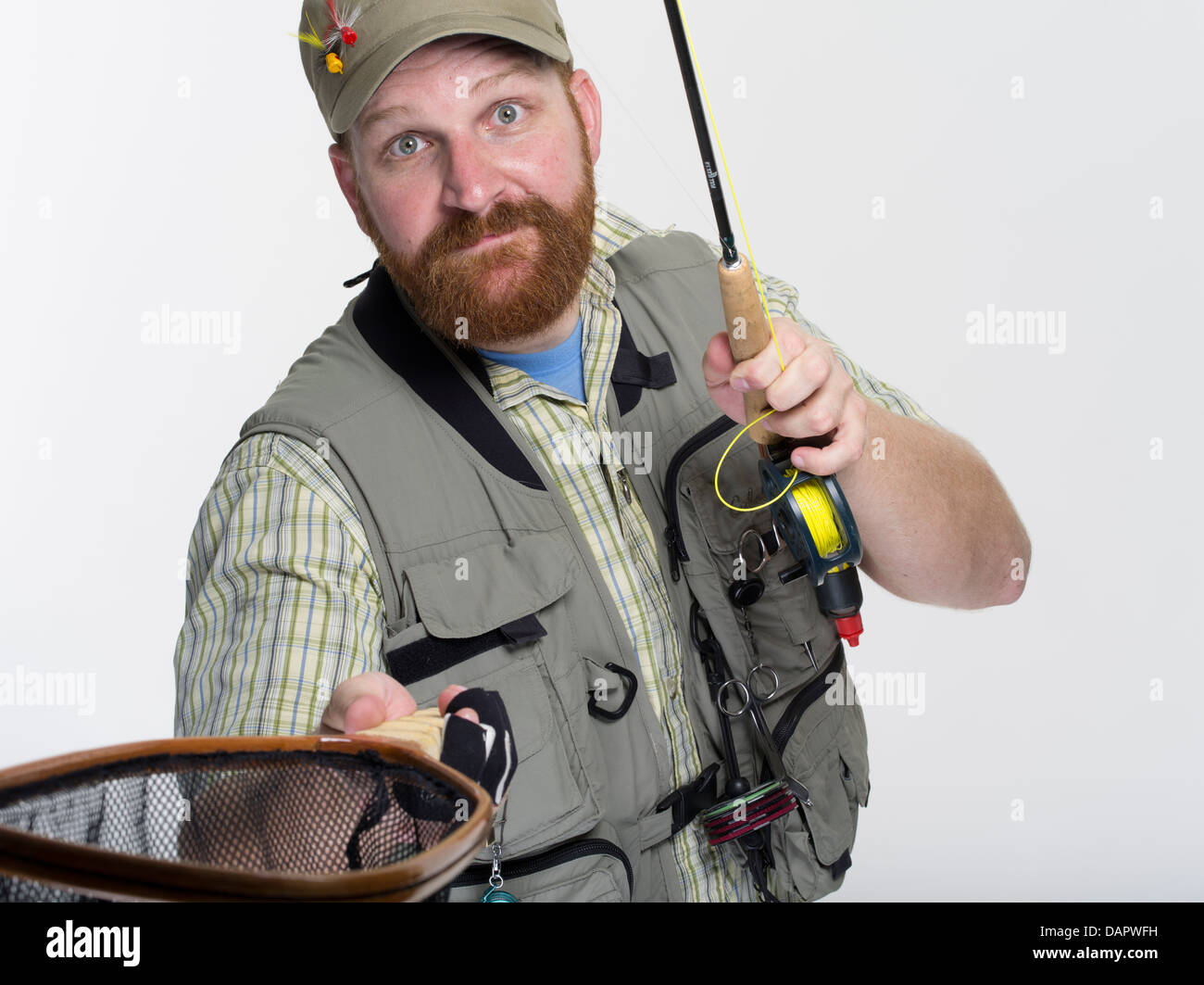 La pêche à la mouche / angler avec rod et net Banque D'Images
