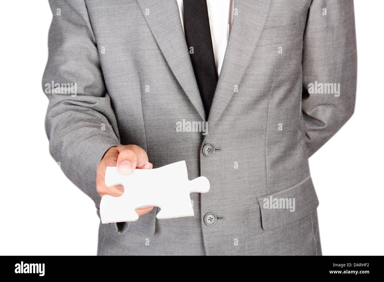 Businessman holding blank jigsaw isolé sur fond blanc avec clipping path Banque D'Images