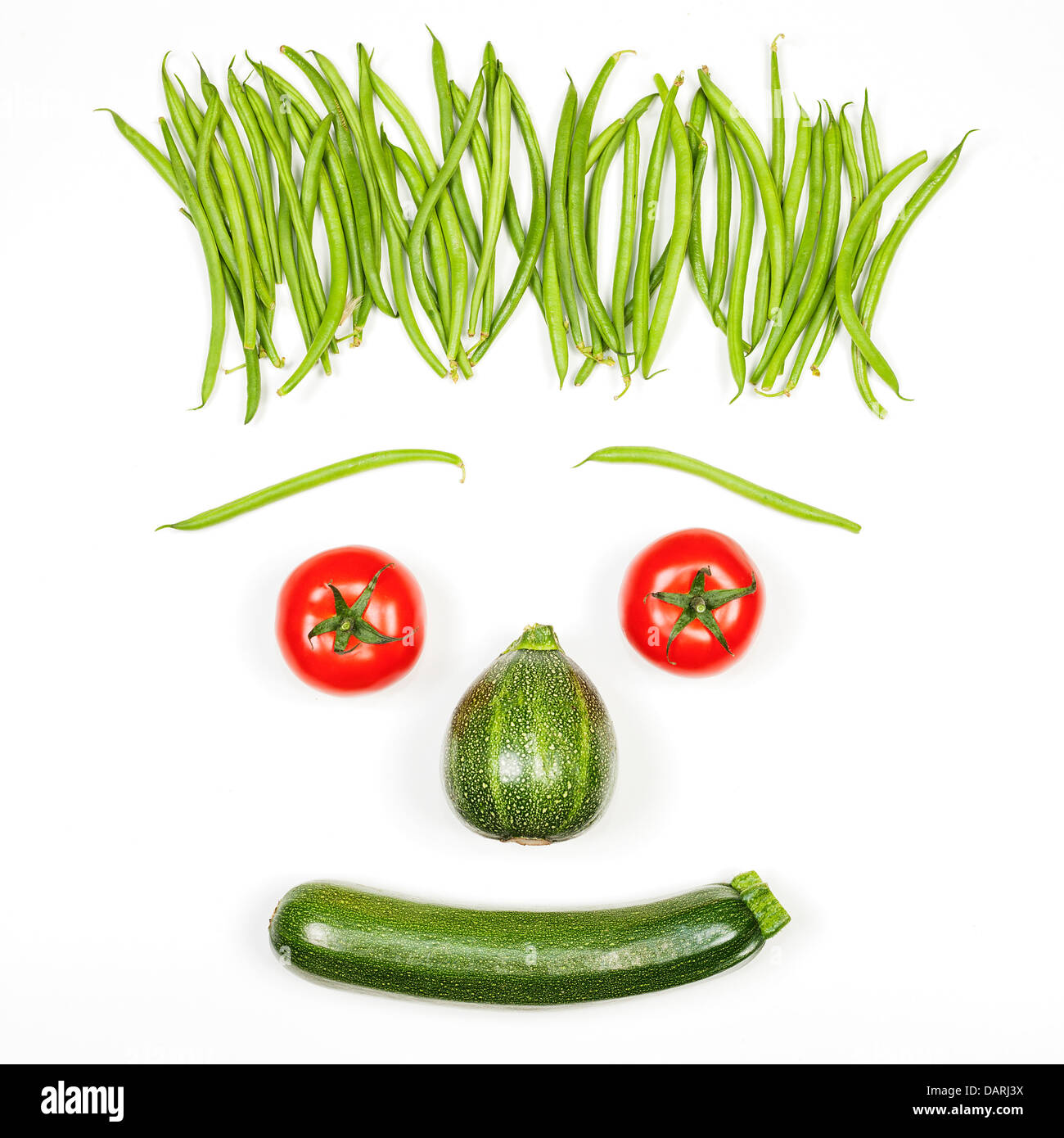 Les légumes frais visage sur fond blanc Banque D'Images