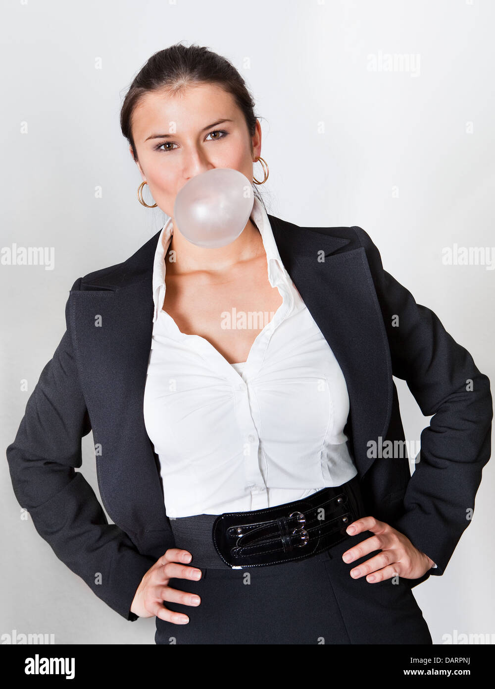 Businesswoman blowing gum Banque D'Images