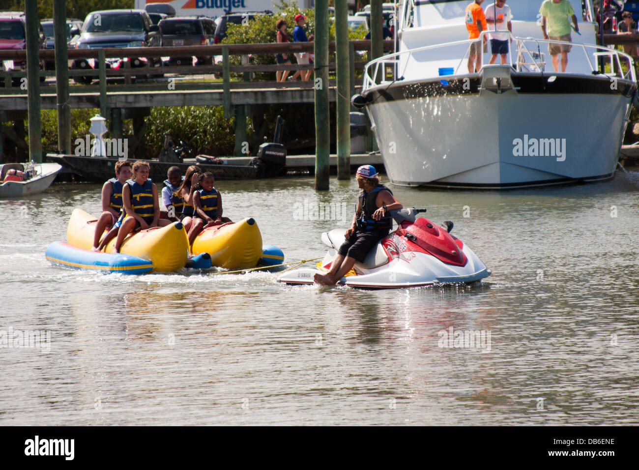 Banana Boat Ride à partir d'un scooter Banque D'Images