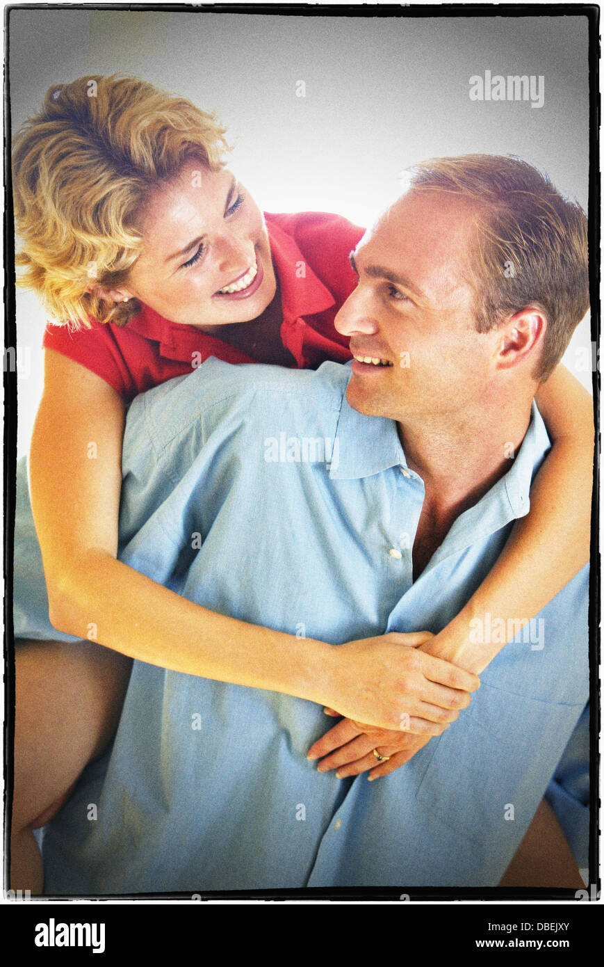 Smiling brother and sister hugging - Image de stock capturée avec un smartphone