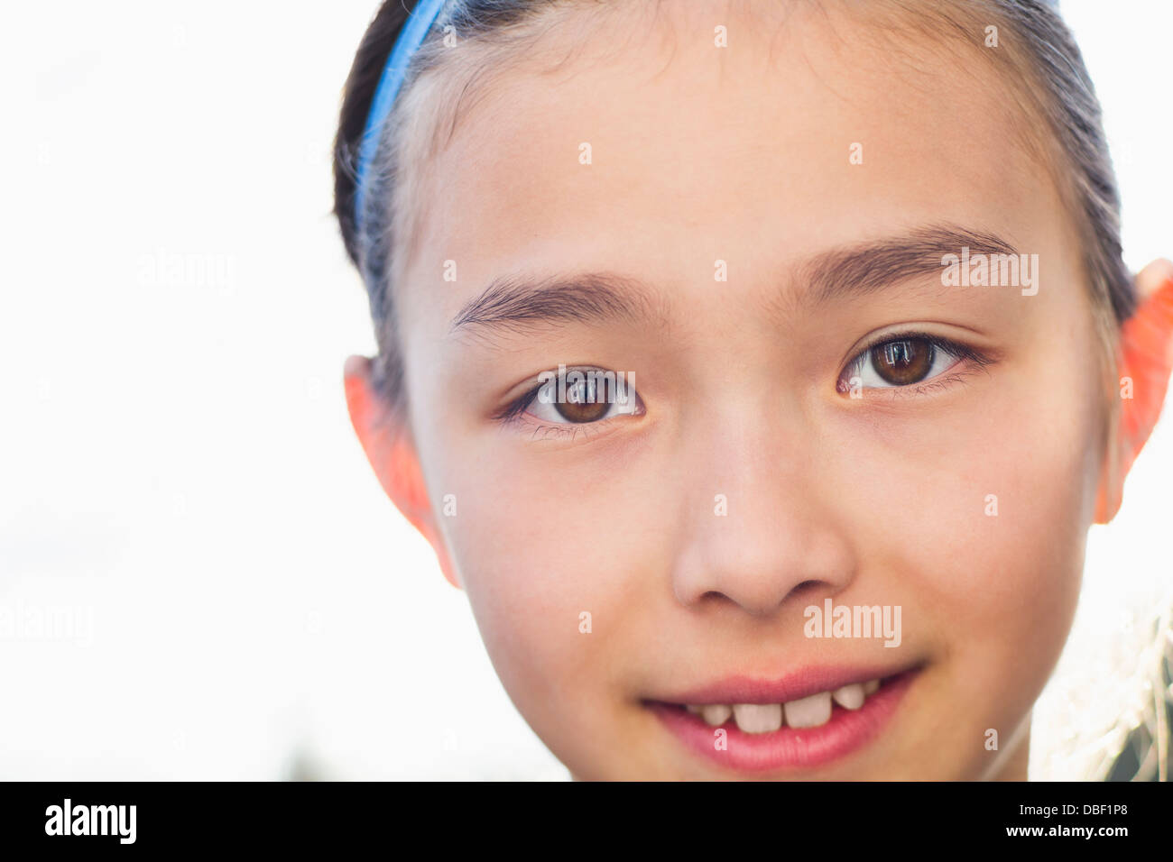 Close up of mixed race girl smiling Banque D'Images