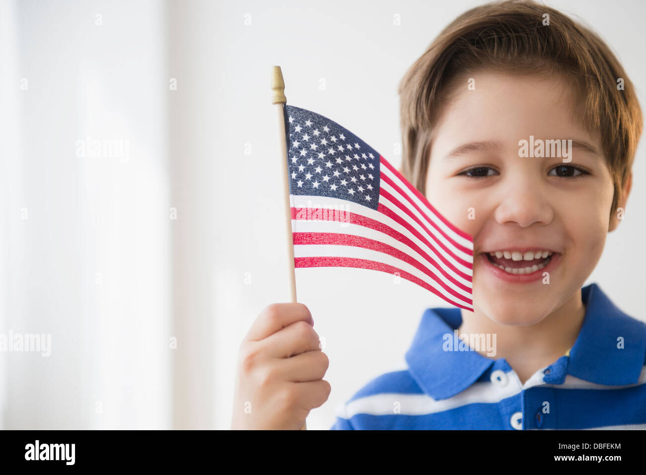 Woman waving American flag Banque D'Images