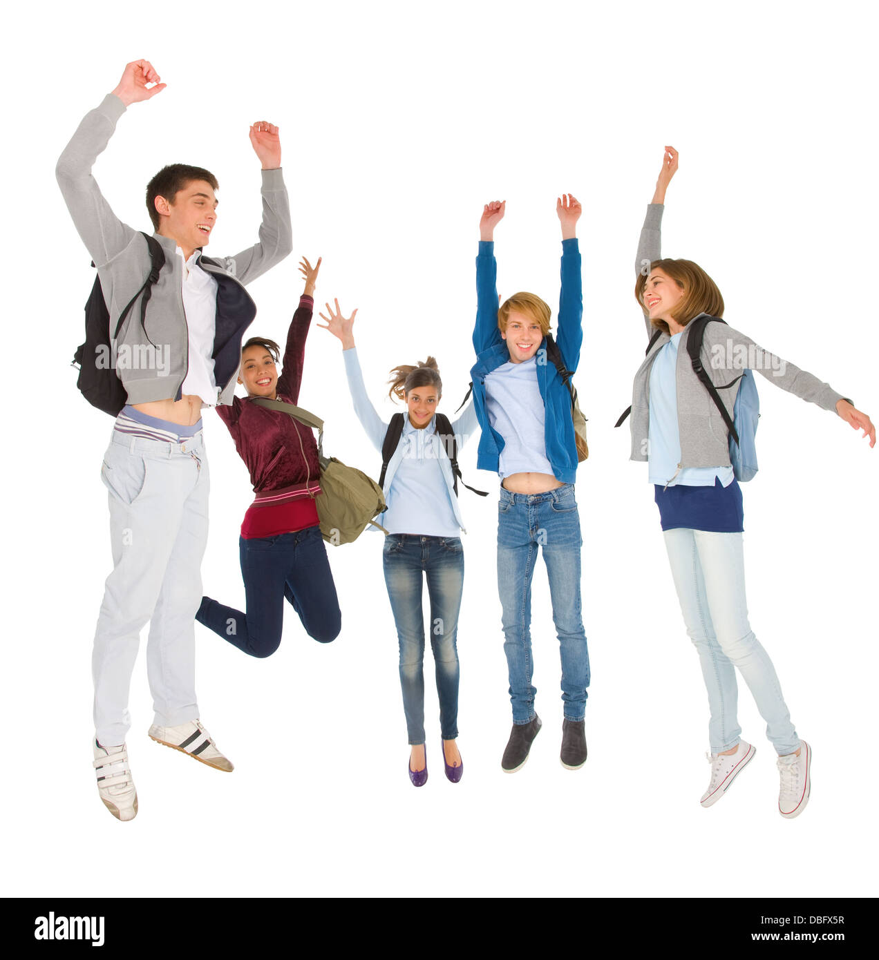 Teenage students jumping Banque D'Images