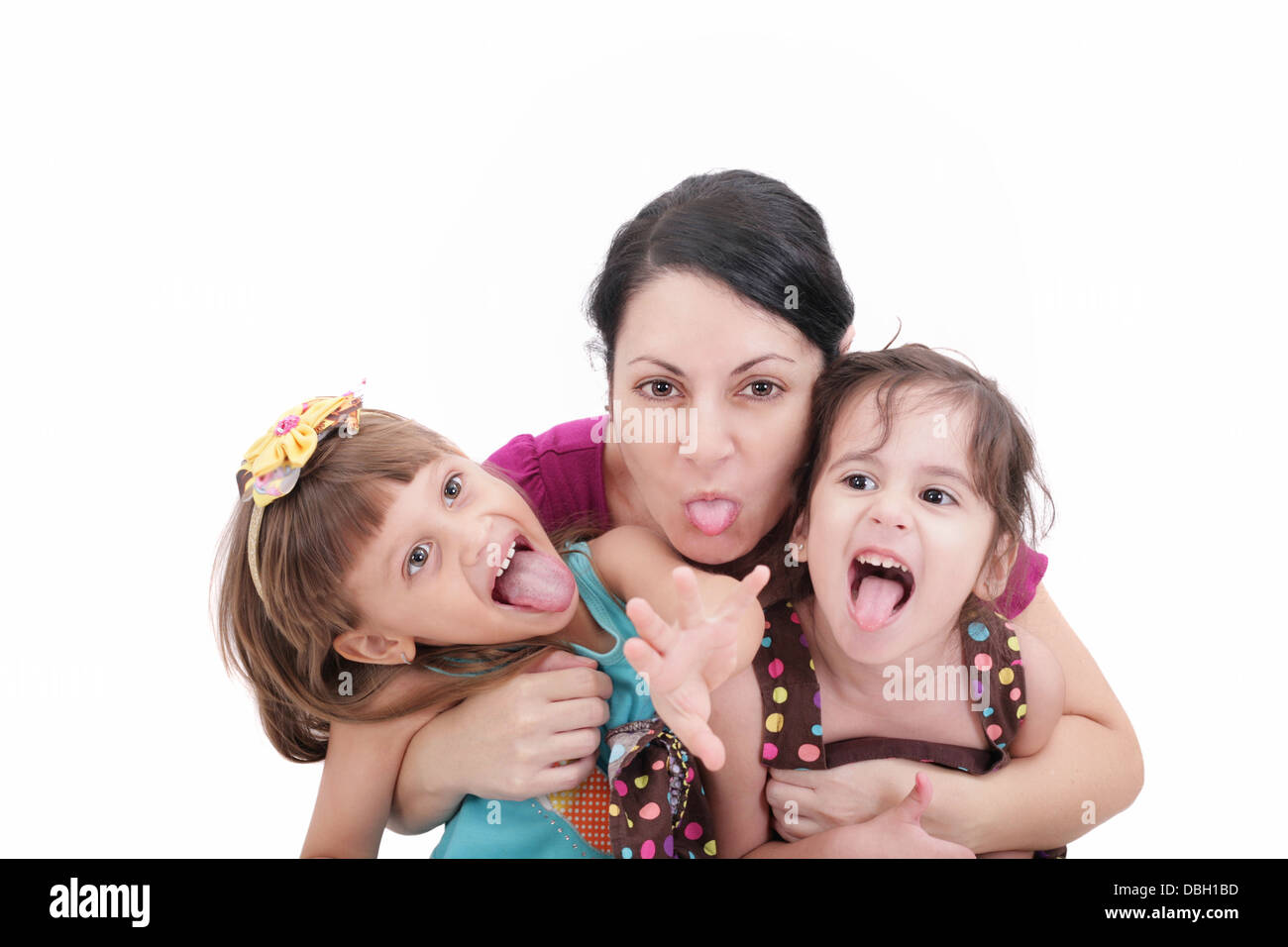 Mère et fille deux tirant funny faces at camera Banque D'Images