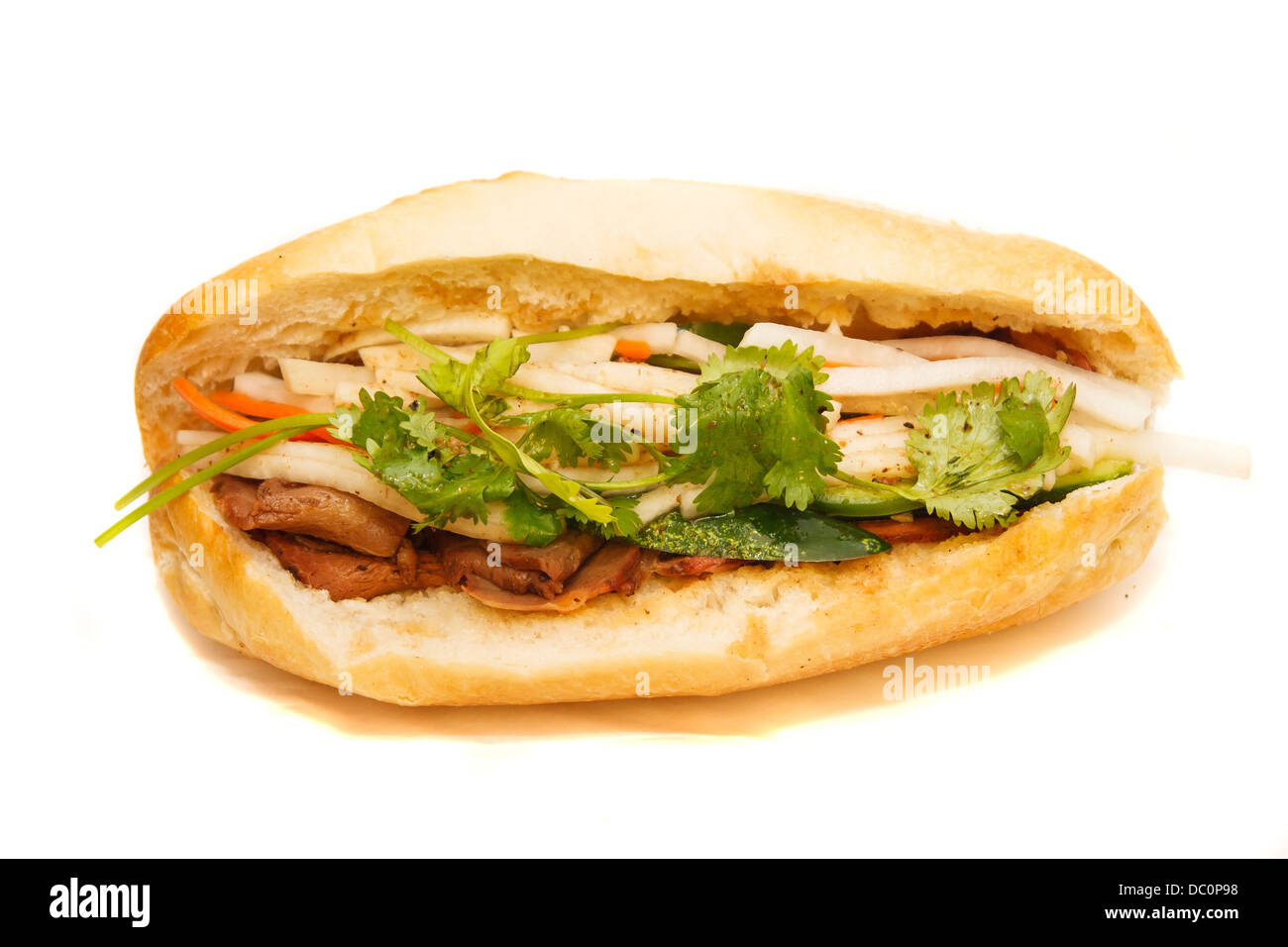 Un sandwich Porc vietnamien sur un petit pain à la coriandre Banque D'Images