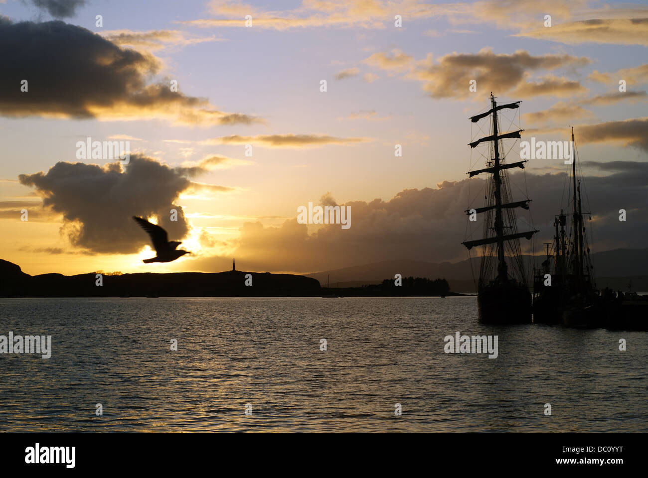 La chance à Oban au coucher du soleil Banque D'Images