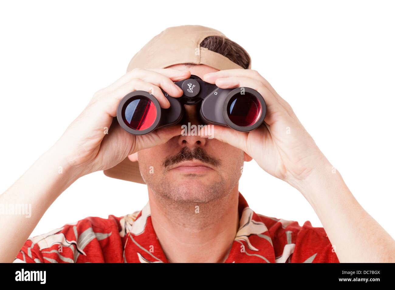 L'homme en chemise hawaïenne avec des jumelles Banque D'Images