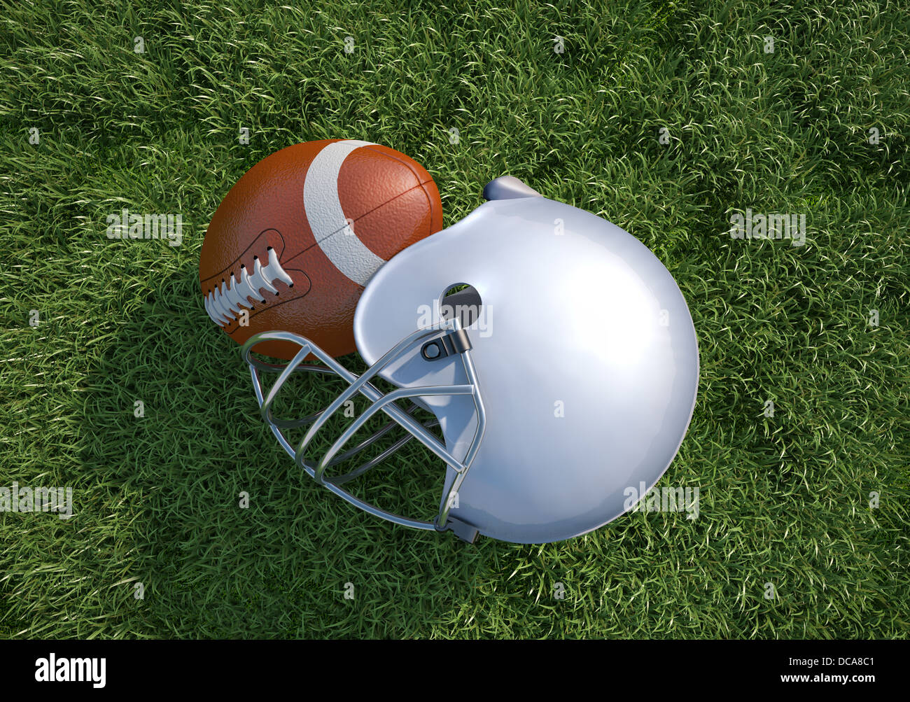 American football helmet et la balle, sur l'herbe. Close up. Vue d'en haut. Banque D'Images