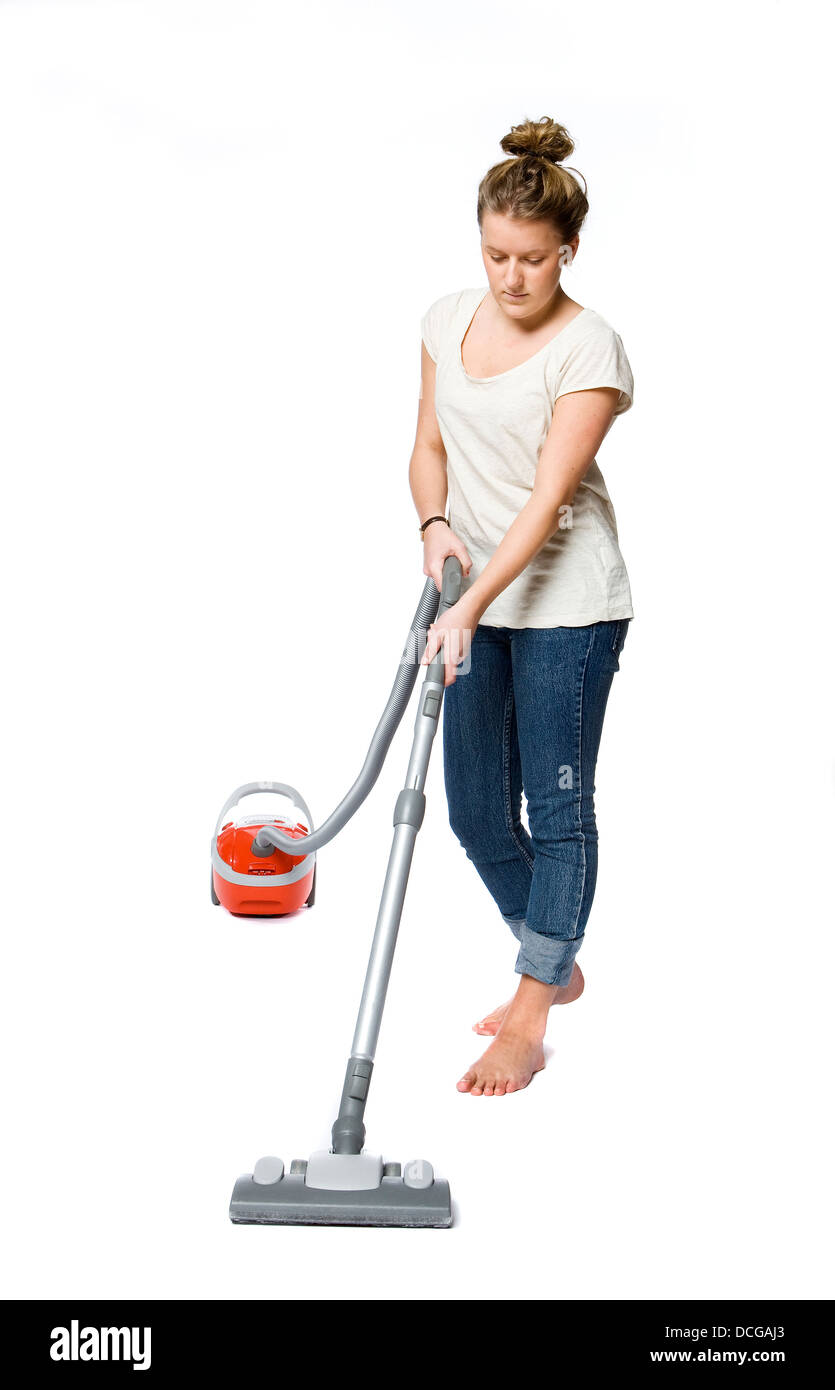 Woman with vacuum cleaner Banque D'Images