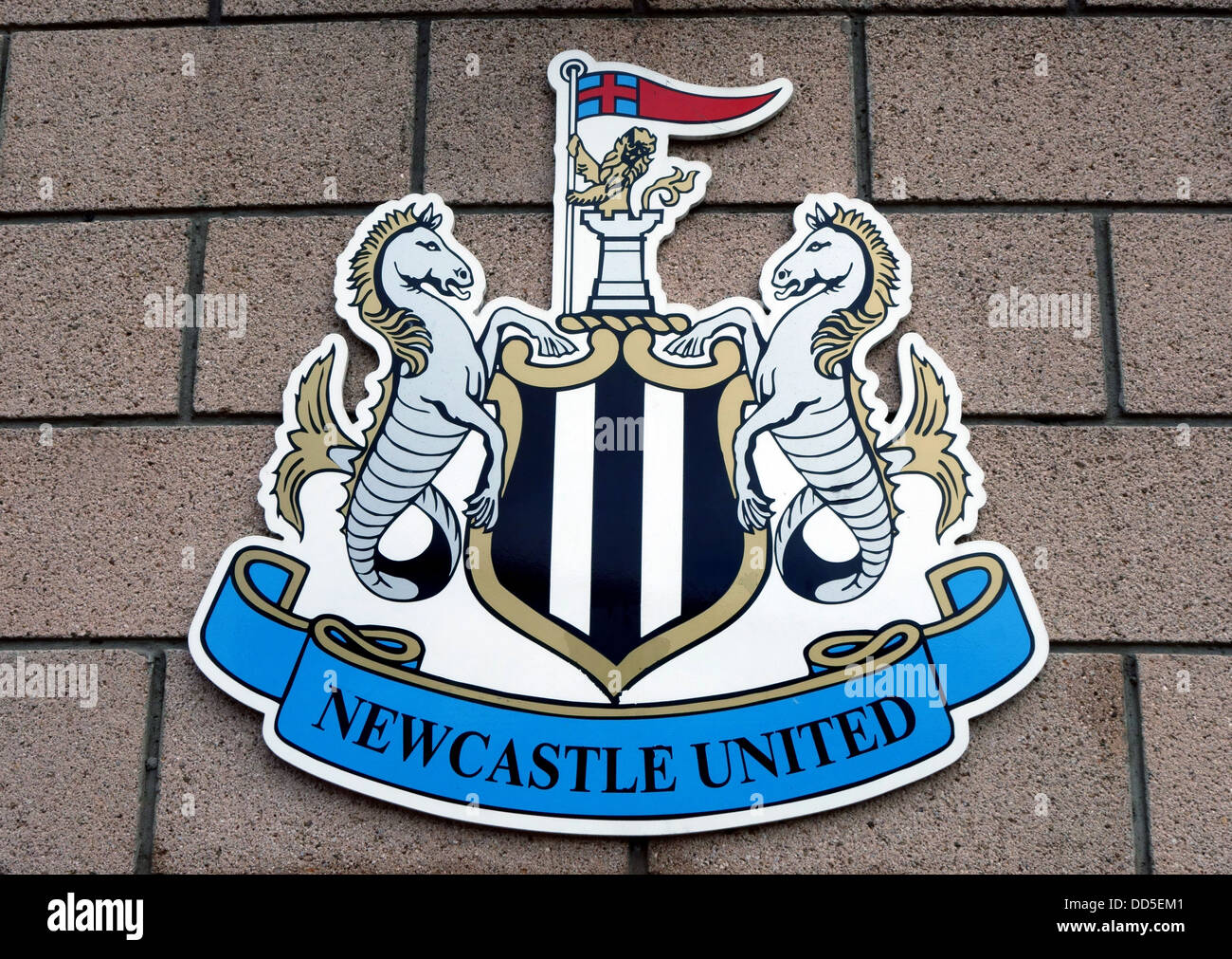 Detailed, embossed FC Barcelona and Newcastle United football club crests against a stadium