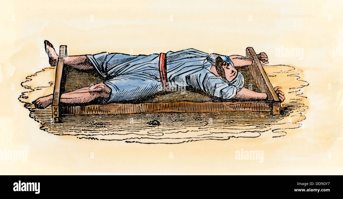 Prisonnier exécuté en le laissant sur une grille dans le désert pour mourir au soleil. À la main, gravure sur bois Banque D'Images