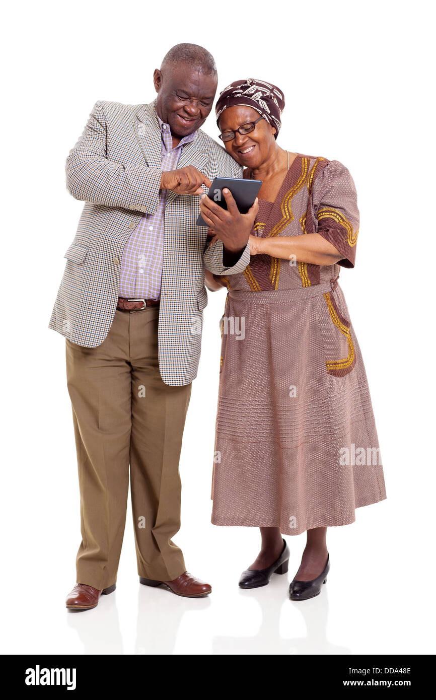 Old African couple using tablet computer isolated on white Banque D'Images