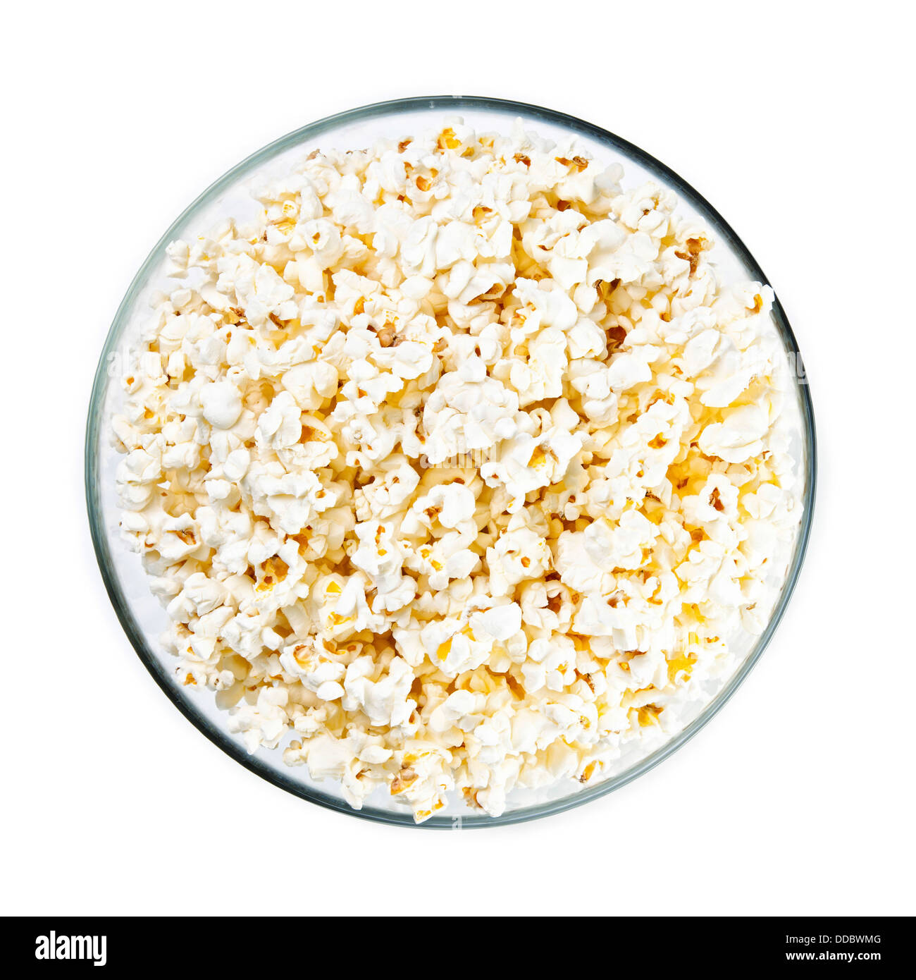 Bol en verre avec le pop-corn sur fond blanc Banque D'Images