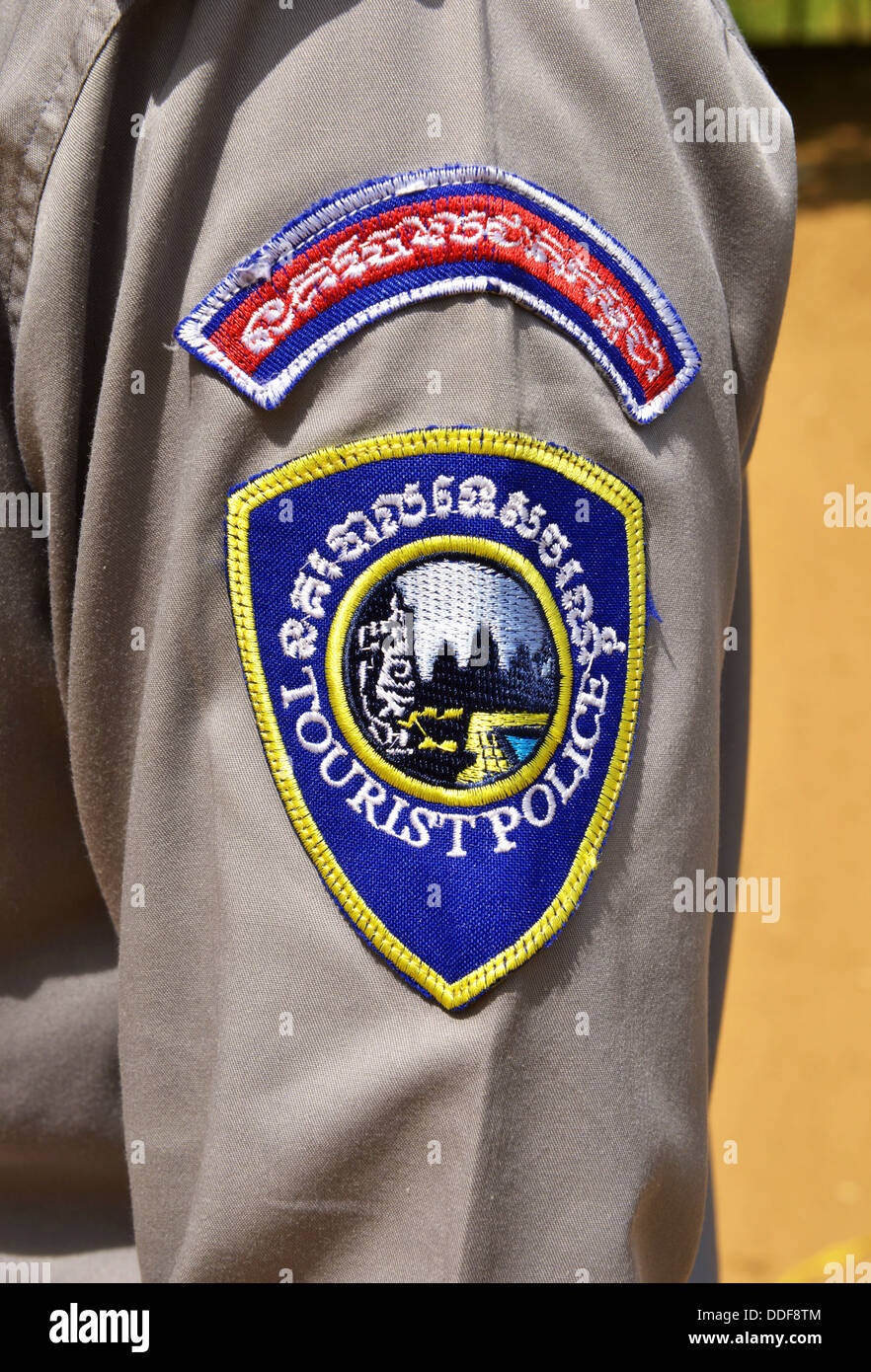 Badge de la police touristique, au Cambodge. Banque D'Images