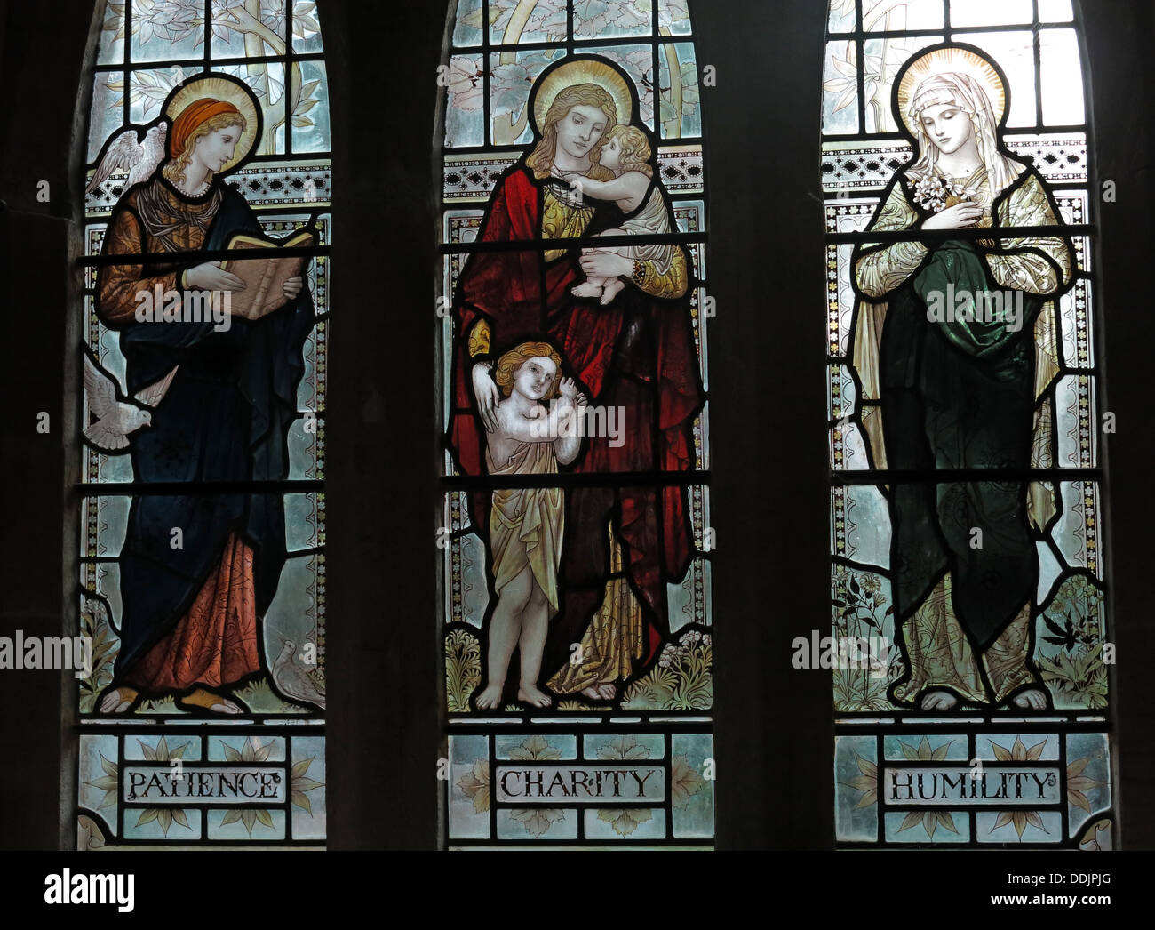 Patience charité humilité vitraux dans une église, l'église St Andrews Fenêtre d'Evercy Brympton Somerset England UK Banque D'Images