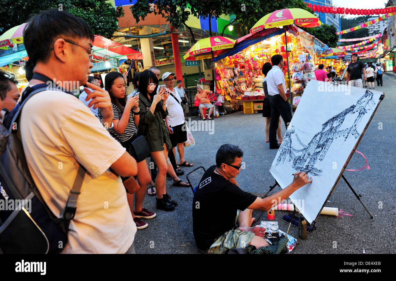 Un artiste de rue dans le quartier chinois de Singapour Banque D'Images