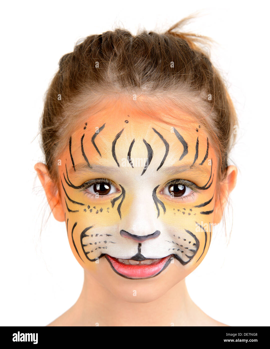 Belle jeune fille au visage peint comme un tigre Banque D'Images
