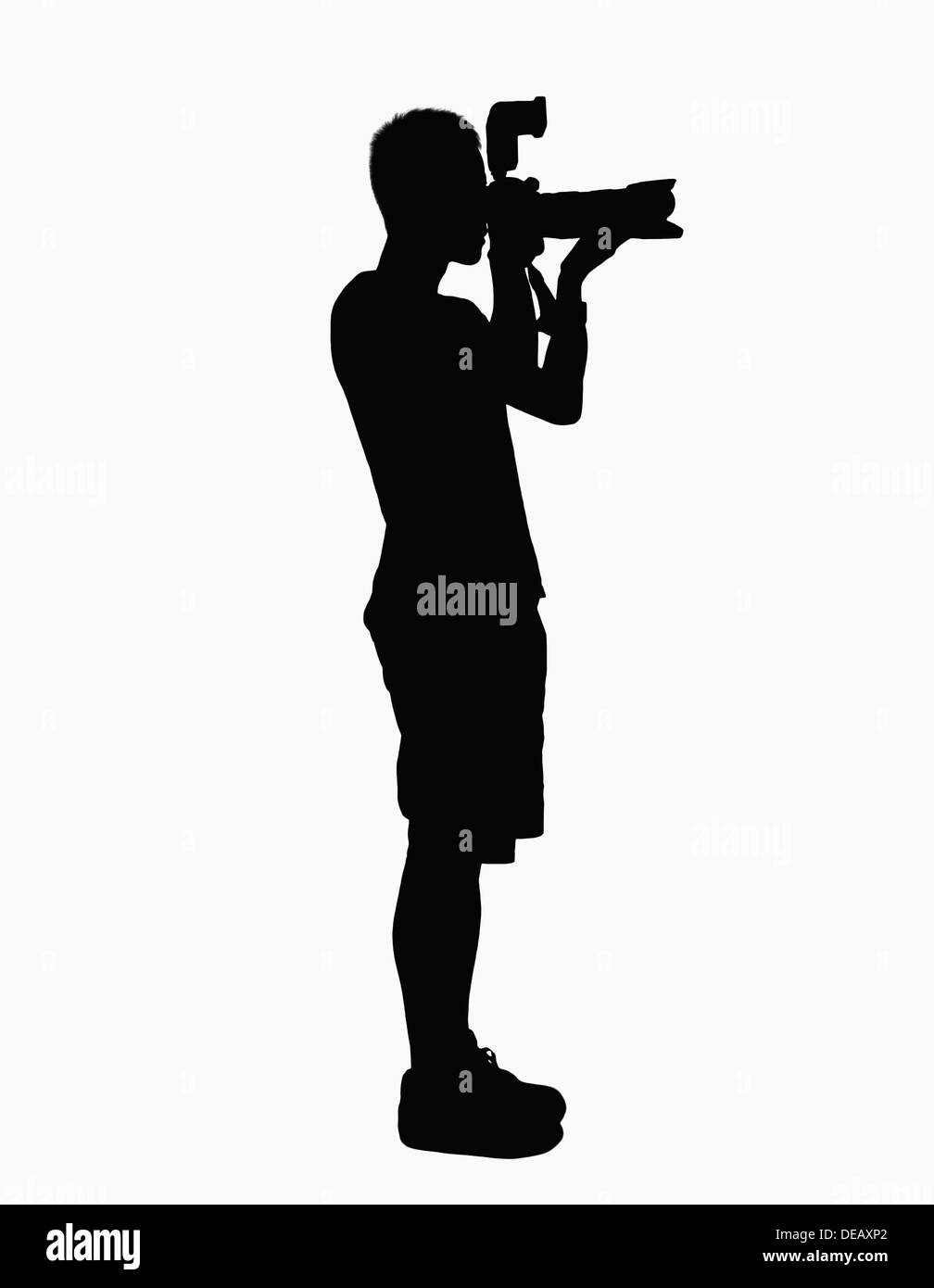 Silhouette of man holding camera. Banque D'Images
