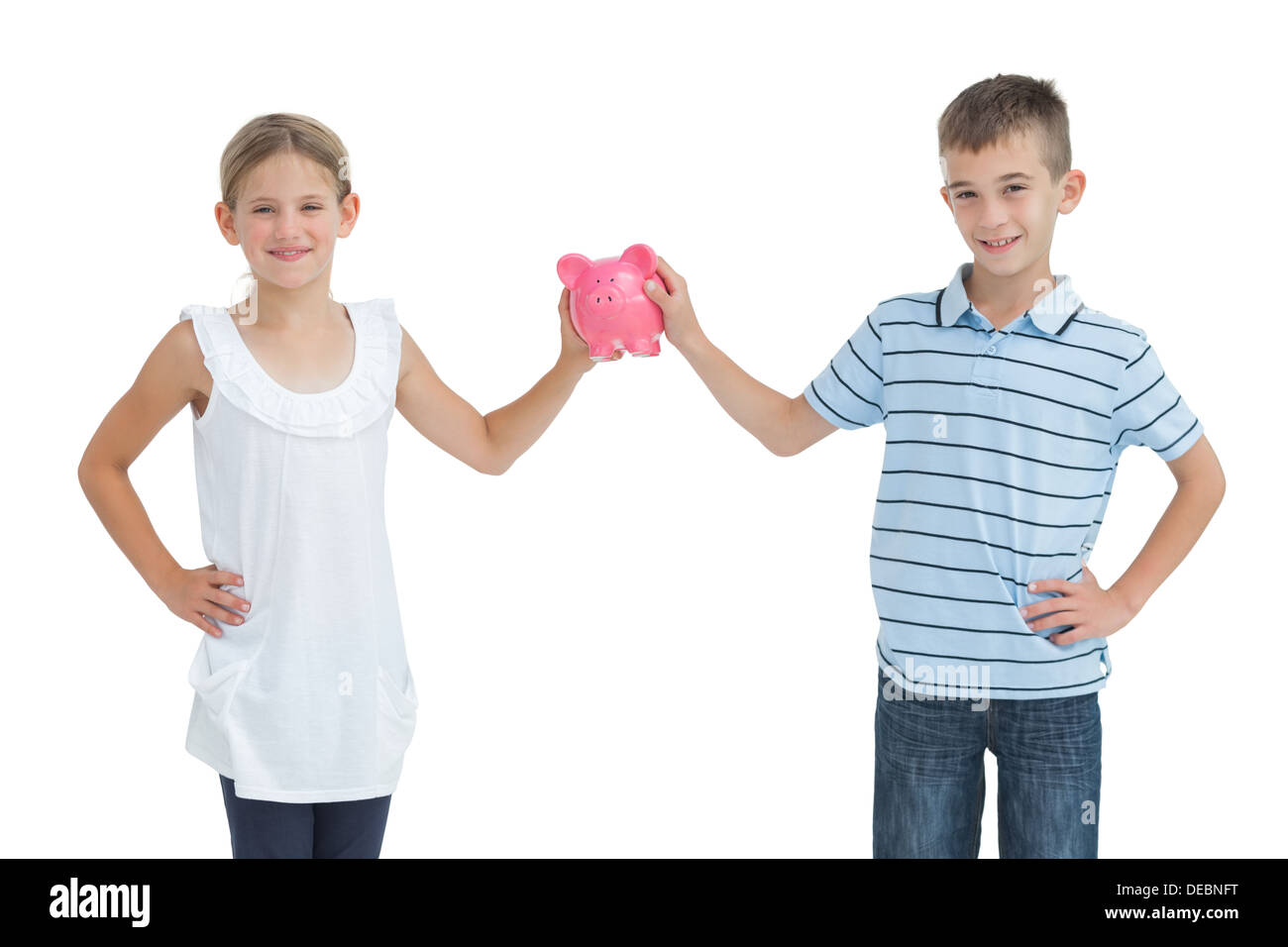 Brother and sister holding piggy bank ensemble Banque D'Images