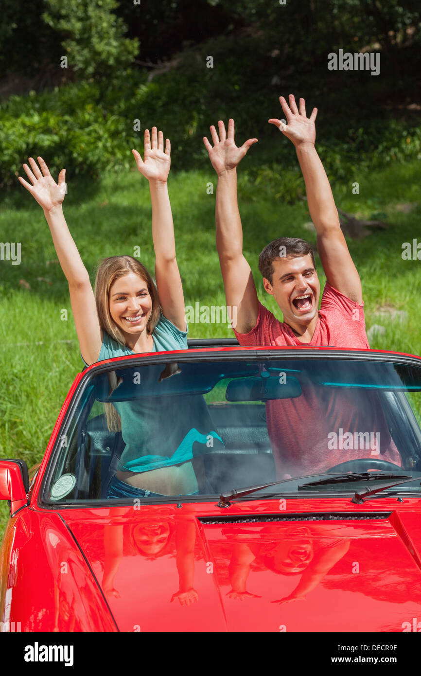 Smiling mature couple cabriolet Banque D'Images