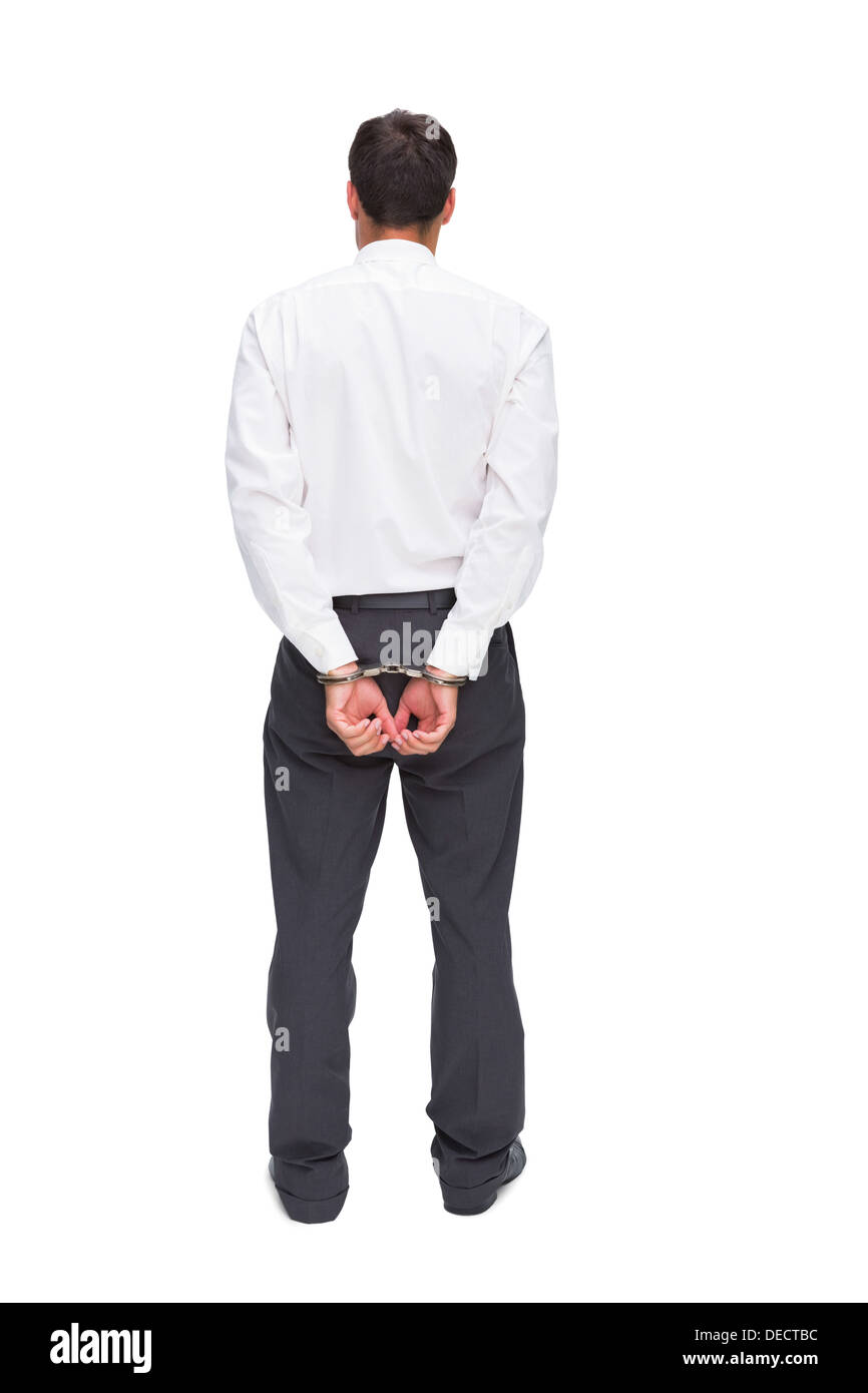 Young businessman wearing handcuffs Banque D'Images