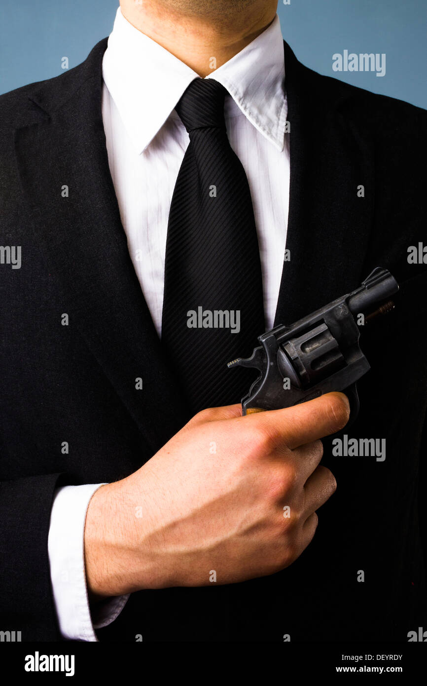 Business man holding a gun Banque D'Images