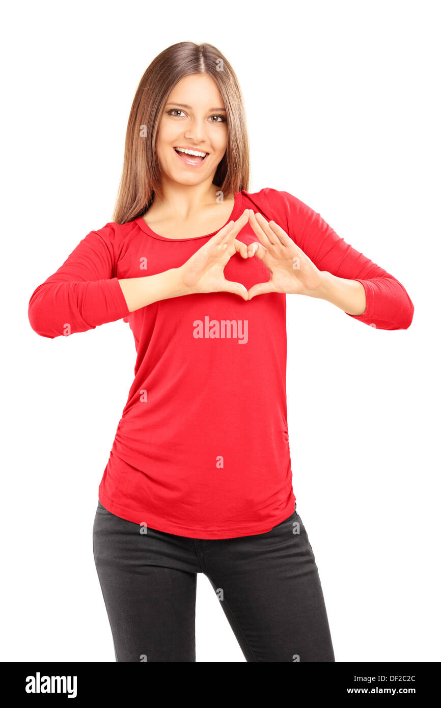 Jeune femme avec ses mains dans la forme de cœur isolé sur fond blanc Banque D'Images