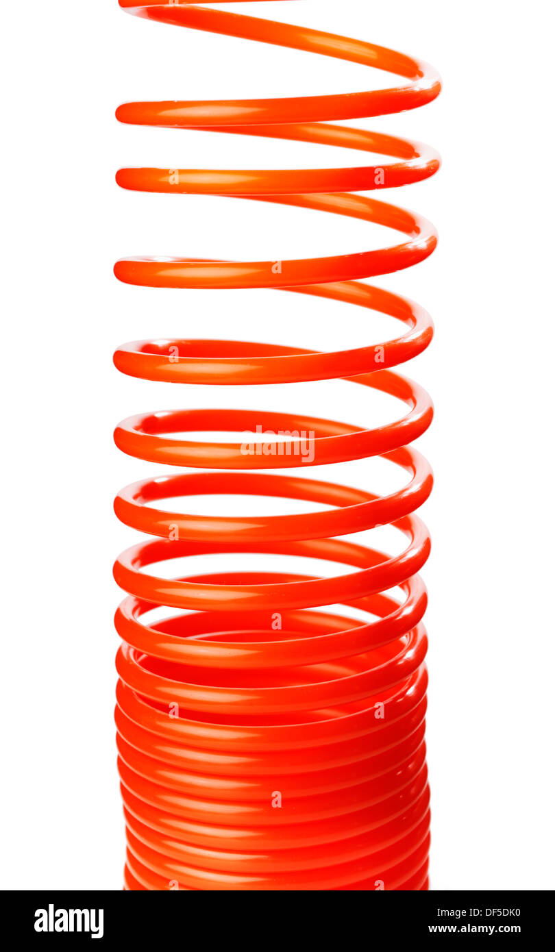 Spirale rouge fine orange flexible d'air utilisé pour outils pneumatiques. Banque D'Images