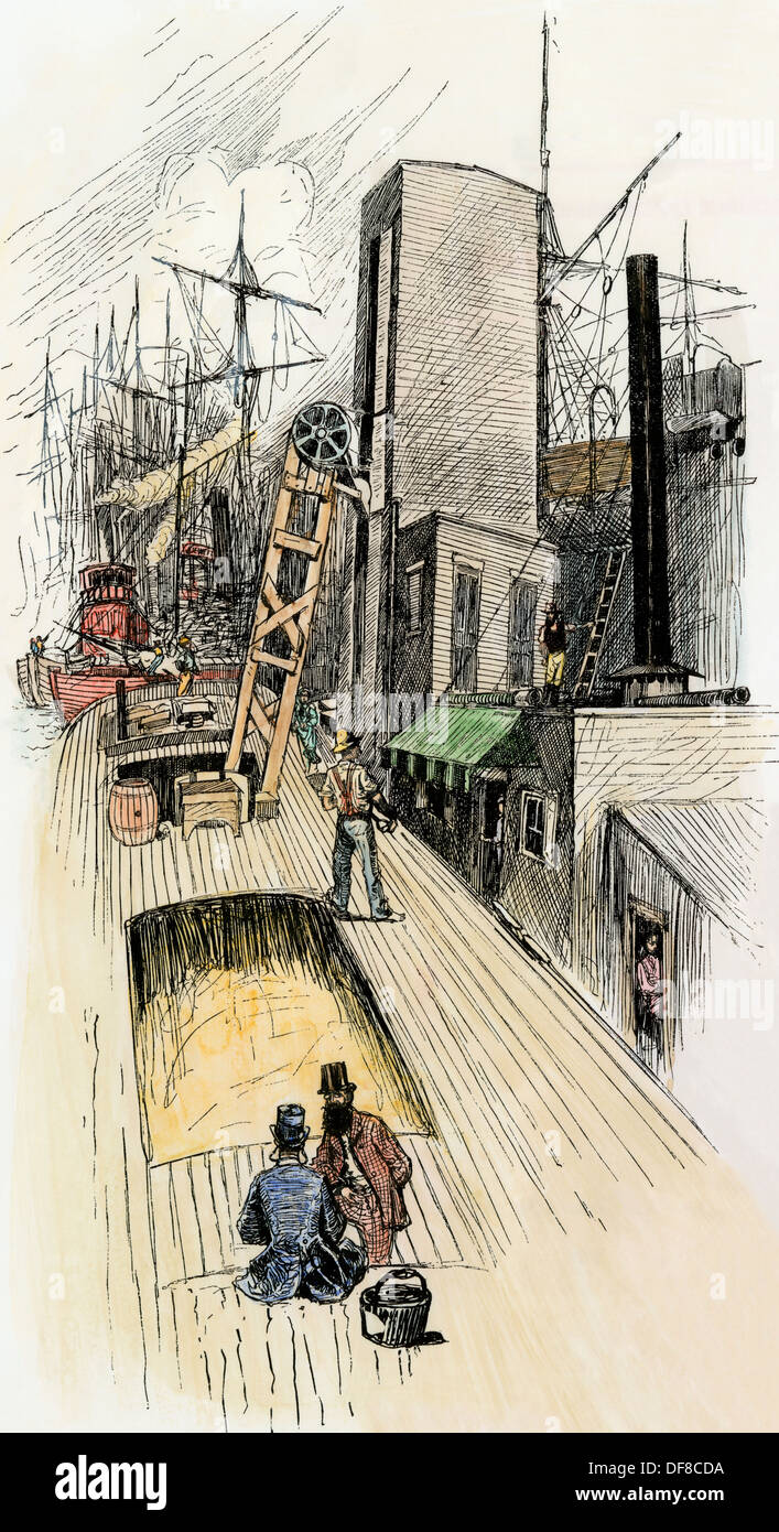 Erie Canal barge déchargement un silo à Buffalo, New York, 1870. À la main, gravure sur bois Banque D'Images