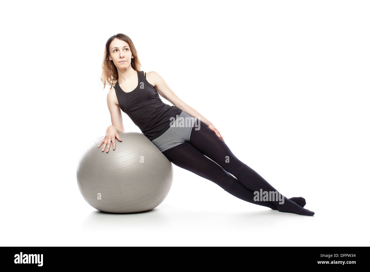 Caucasian woman l'exercice de pilates poses, isolé en studio Banque D'Images