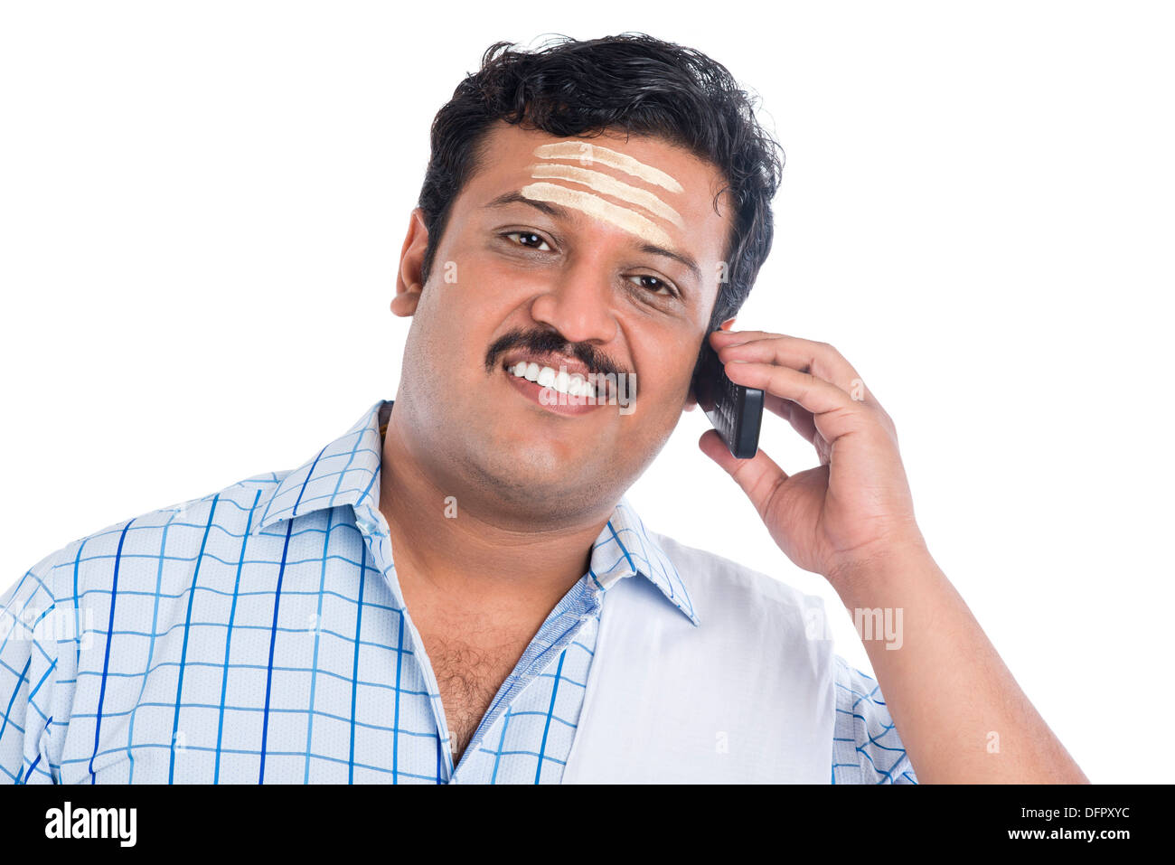 South Indian man talking on a mobile phone Banque D'Images