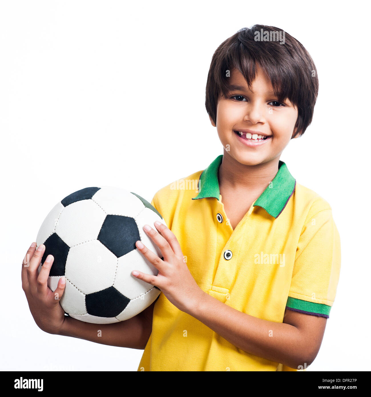 Portrait of a Boy holding a soccer ball and smiling Banque D'Images