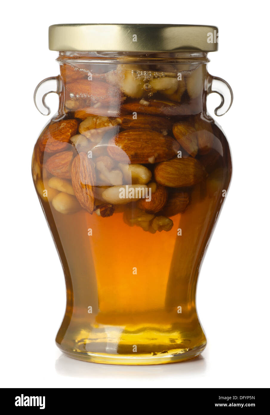 Pot de miel et noix isolated on white Banque D'Images