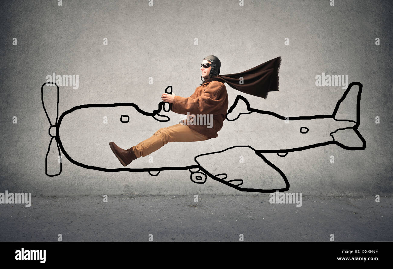 Conduite Aviator un avion dessiné sur un mur Banque D'Images