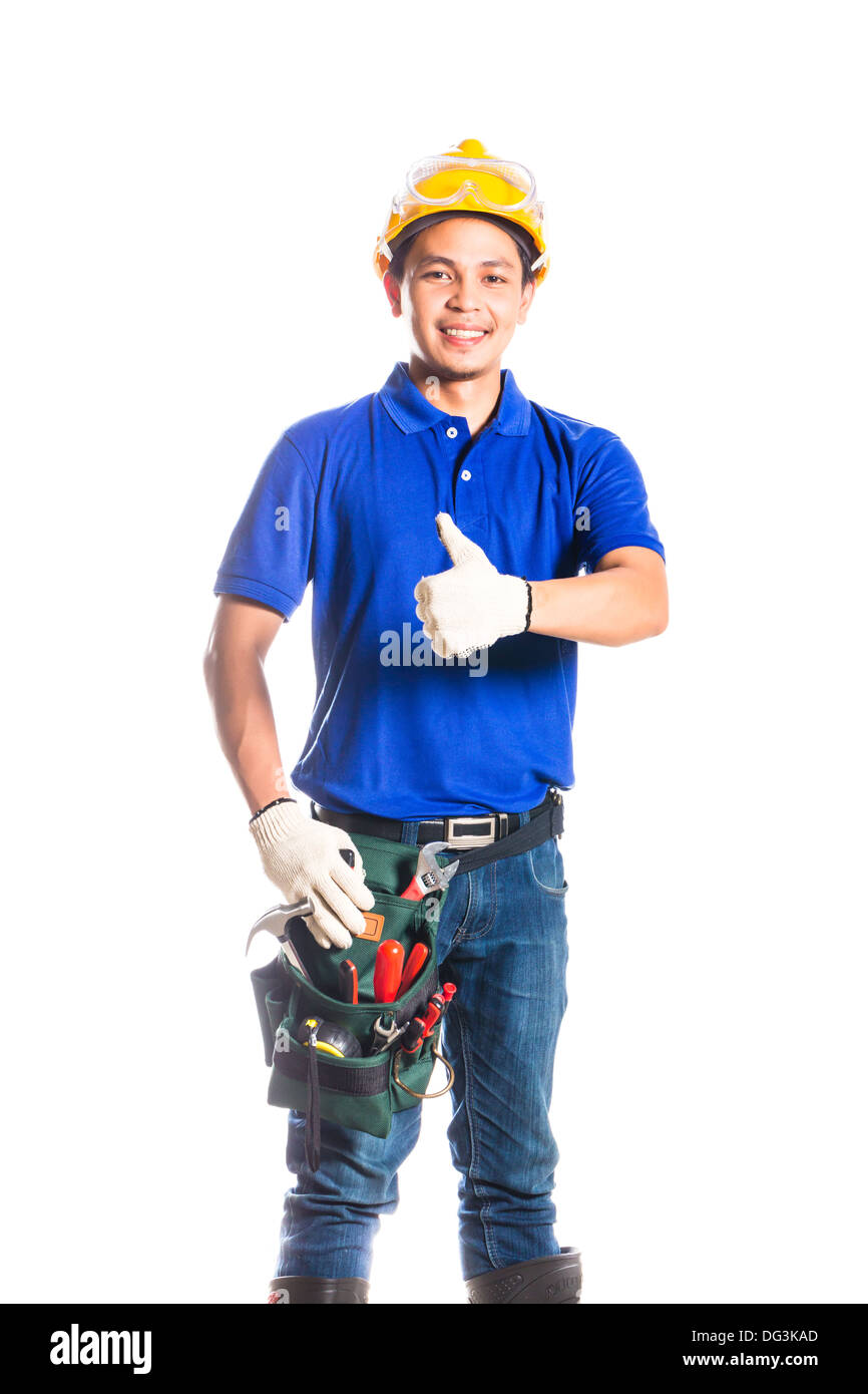 Constructeur asiatique indonésien ou travailleur de la construction avec casque et ceinture d'outils Banque D'Images