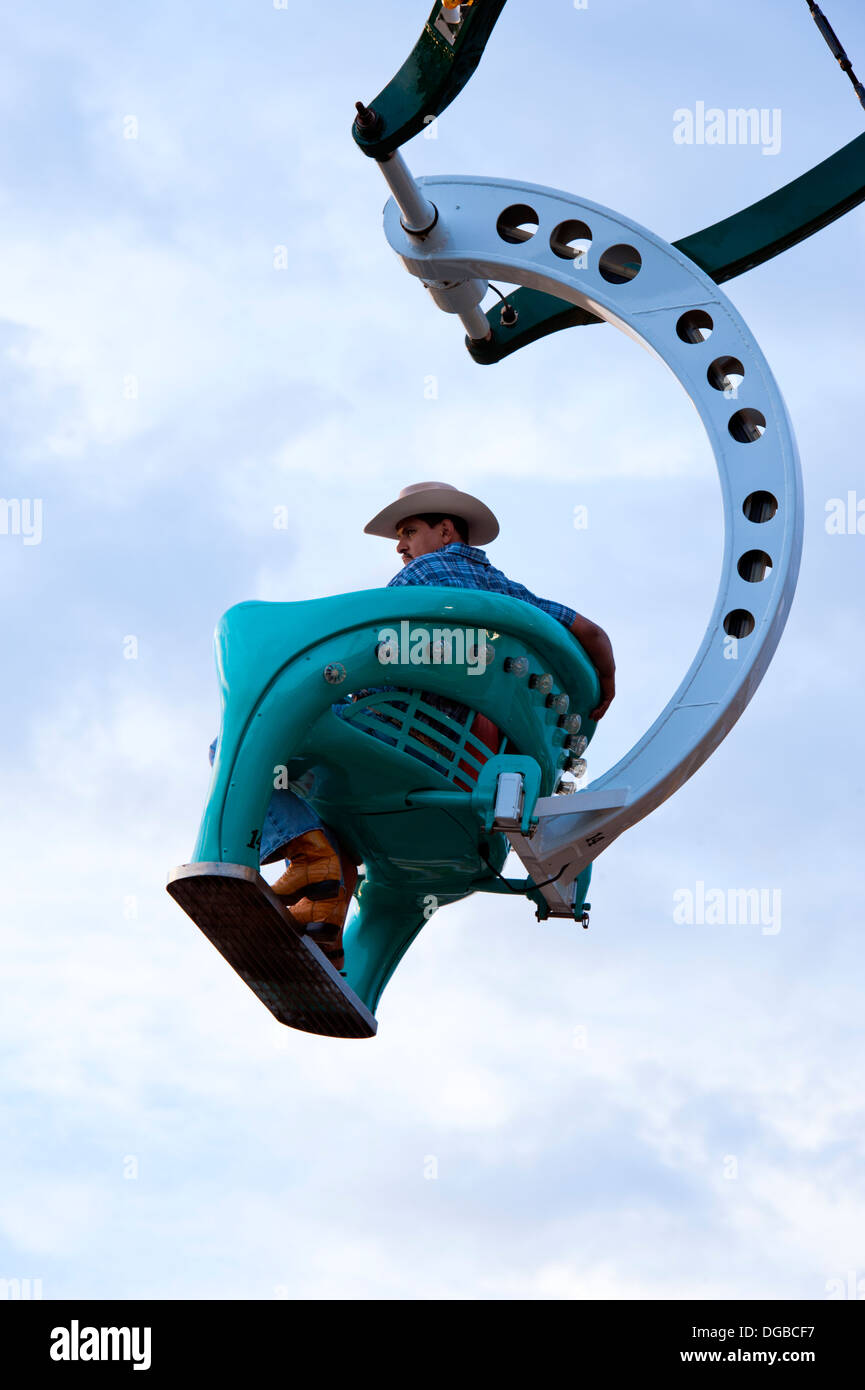 Un cow-boy sur la Grande Roue ride au North Carolina Mountain State Fair Banque D'Images