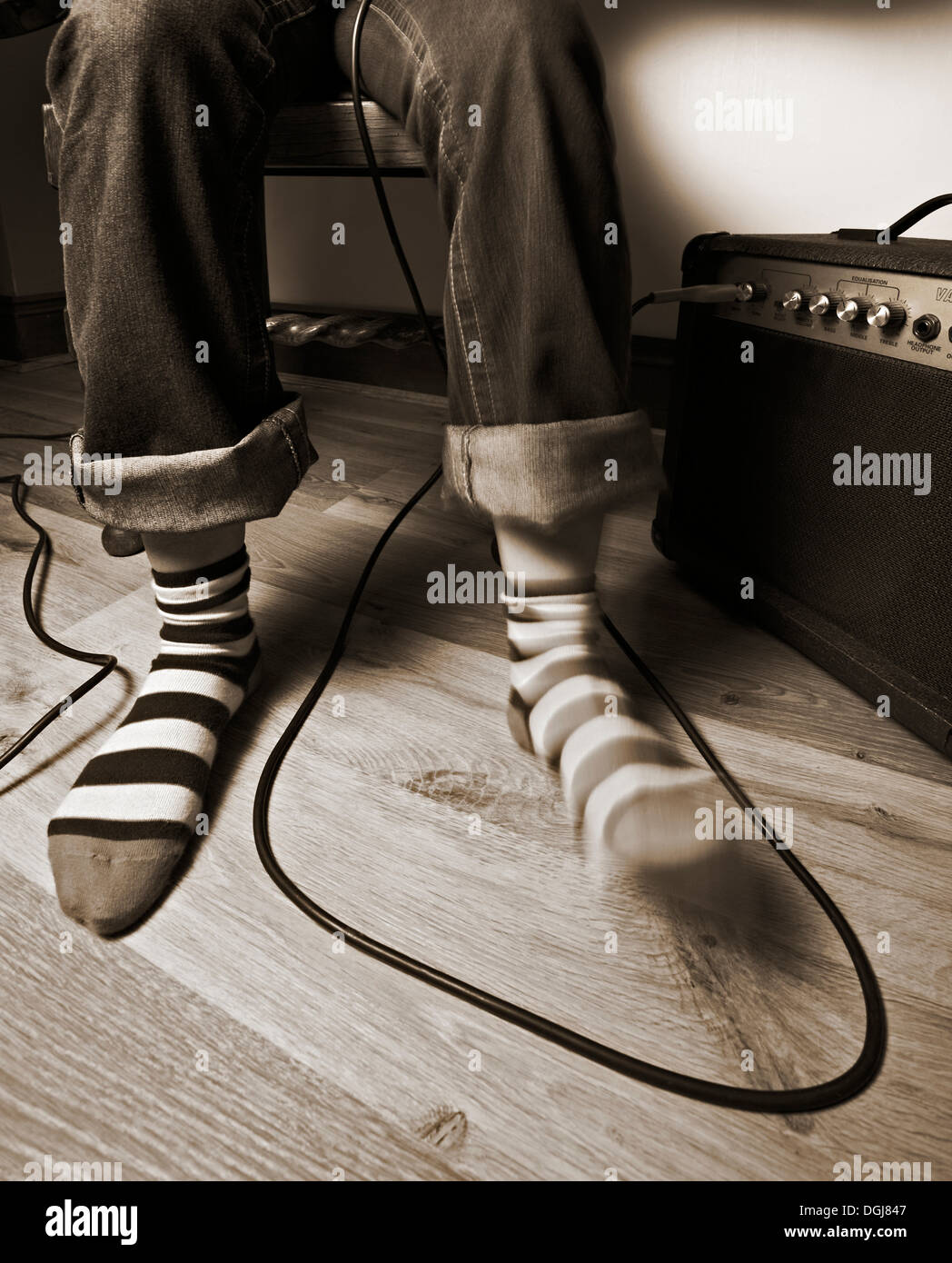 Pieds dans un temps avec la musique. Banque D'Images