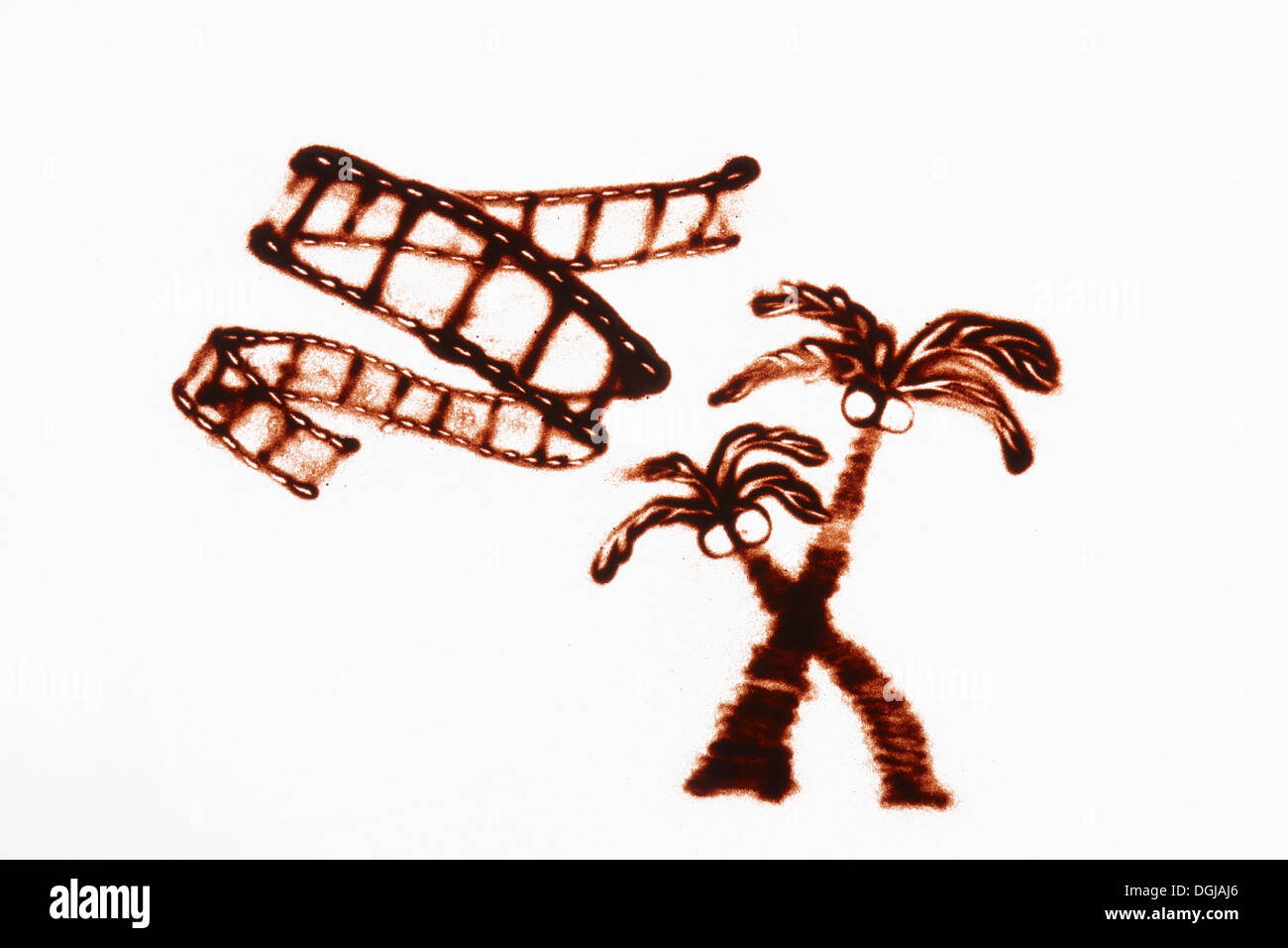 Un dessin sur sable de palmiers Banque D'Images