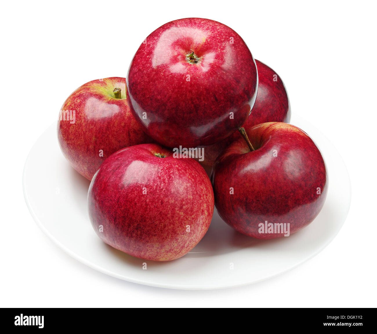 Pommes rouges dans une assiette sur white Banque D'Images