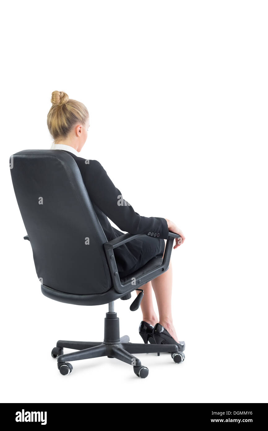 Vue arrière du chic young sur une chaise de bureau Banque D'Images