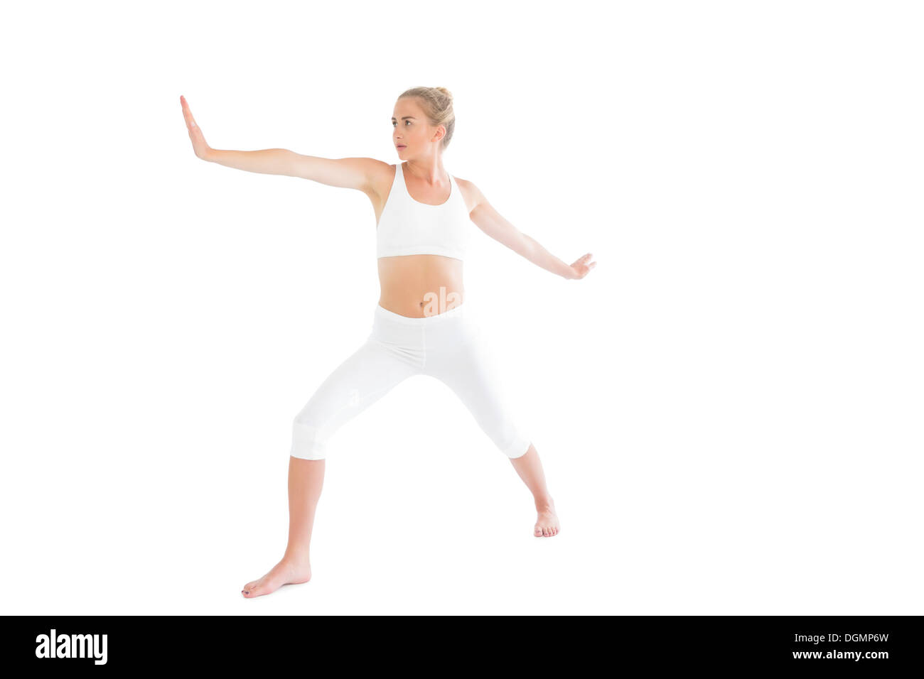 L'accent tonique blonde faisant du yoga exercice Banque D'Images