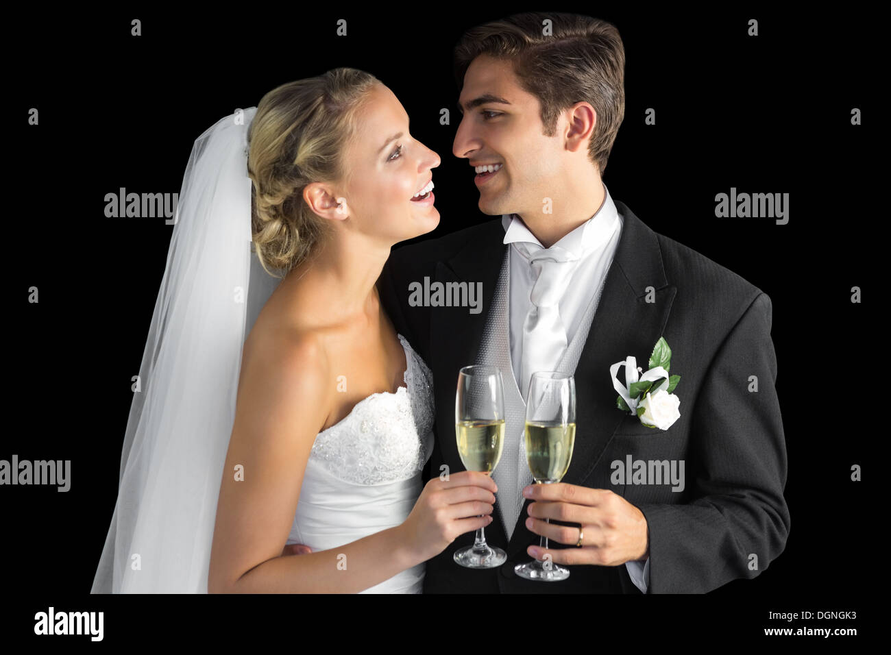 Cheerful married couple holding champagne glasses Banque D'Images