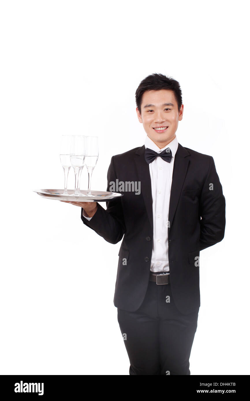 Man in tuxedo holding a plate Banque D'Images
