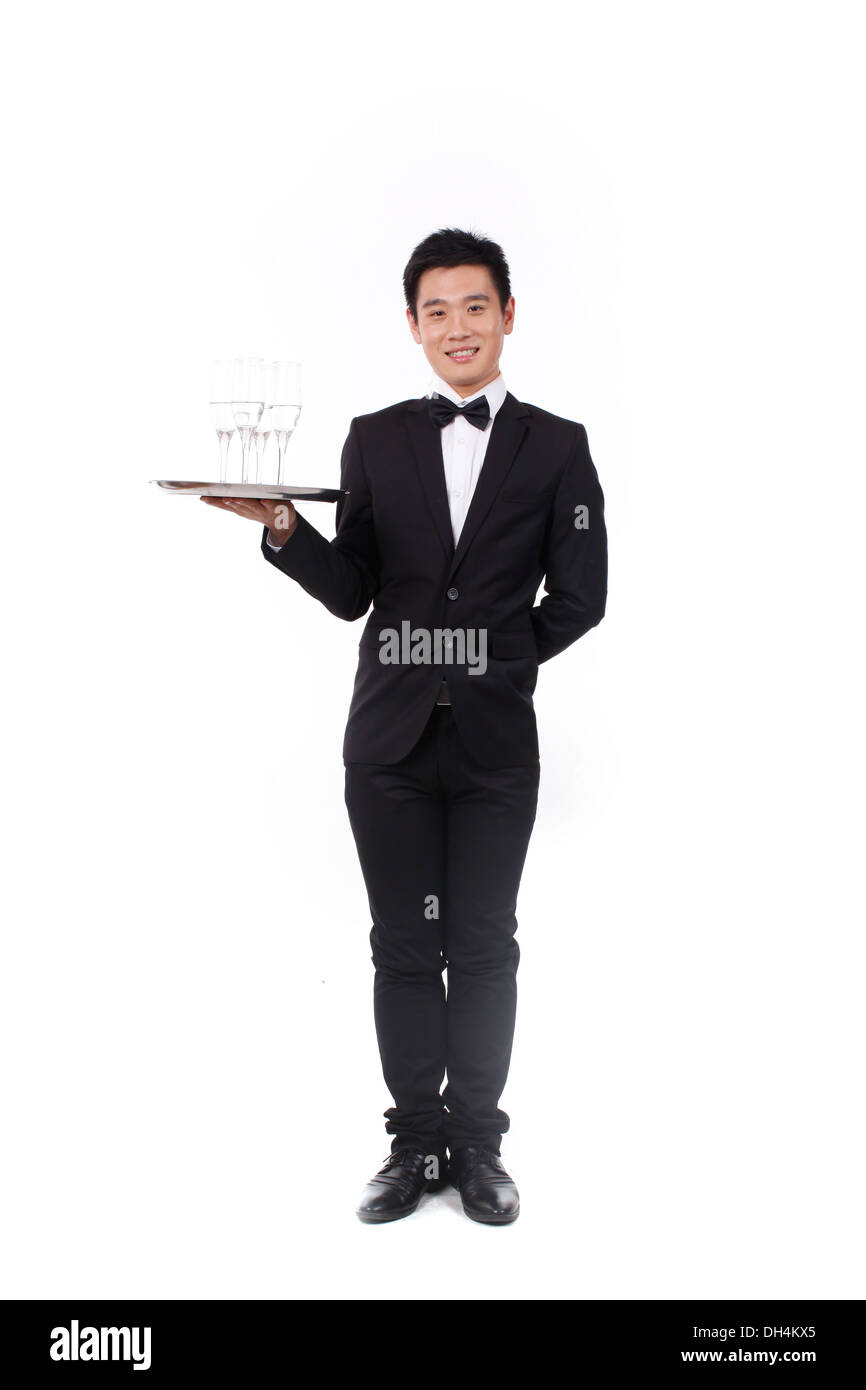 Man in tuxedo holding a plate Banque D'Images