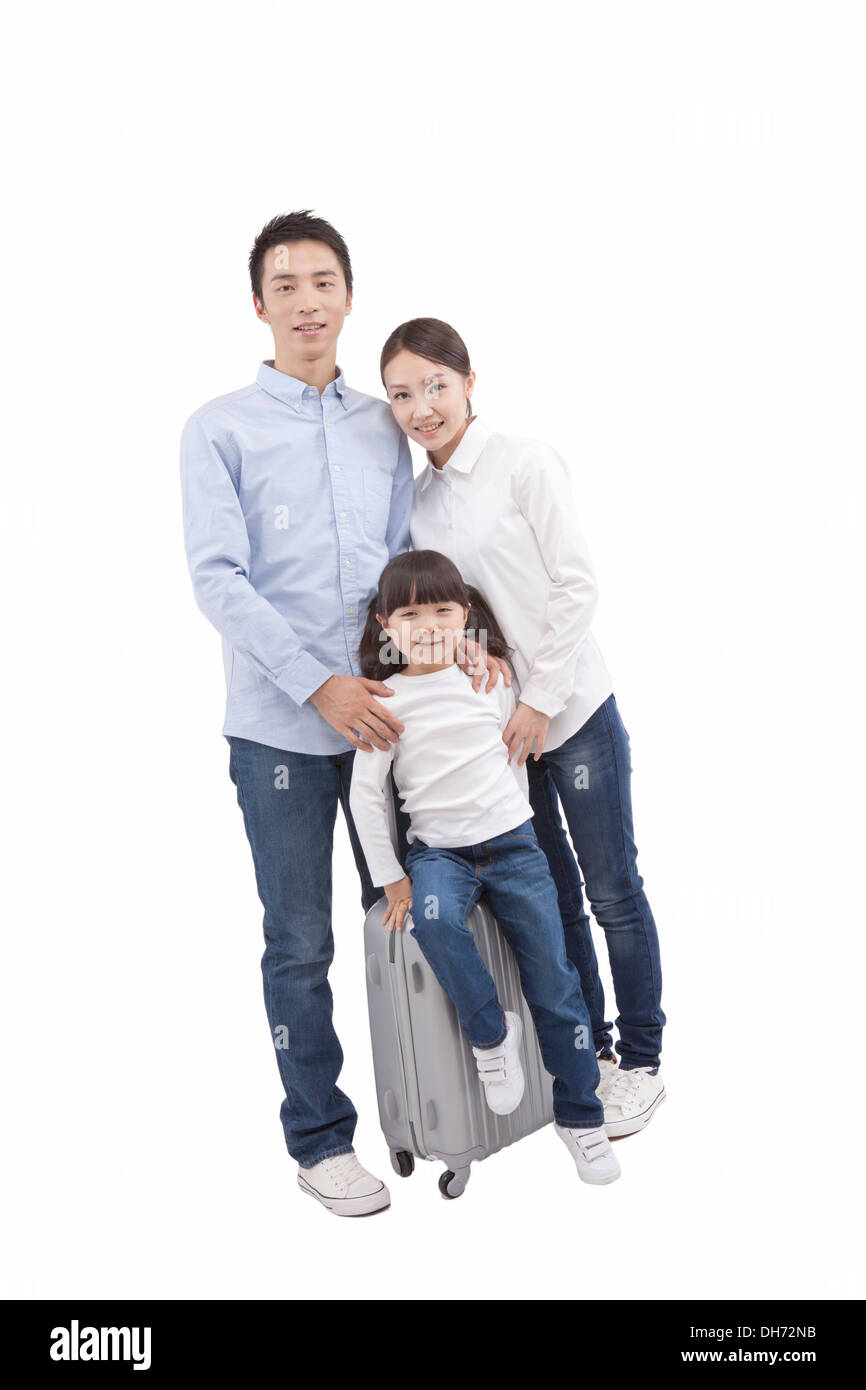 Une famille de trois Pulling suitcase Banque D'Images