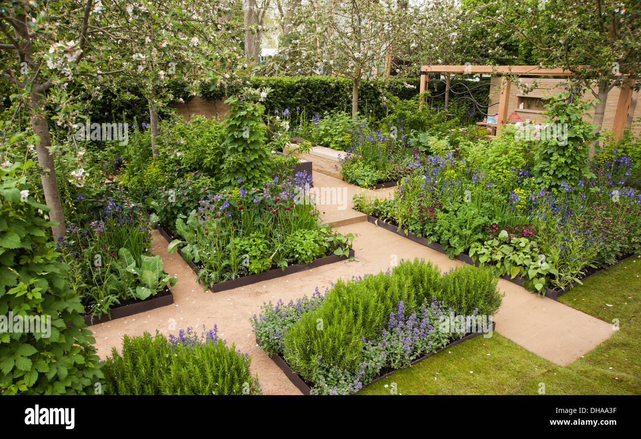 Chelsea Flower Show 2013, Homebase garden, 'En raison les graines du changement' designer Adam Frost. Médaille d'or. Banque D'Images