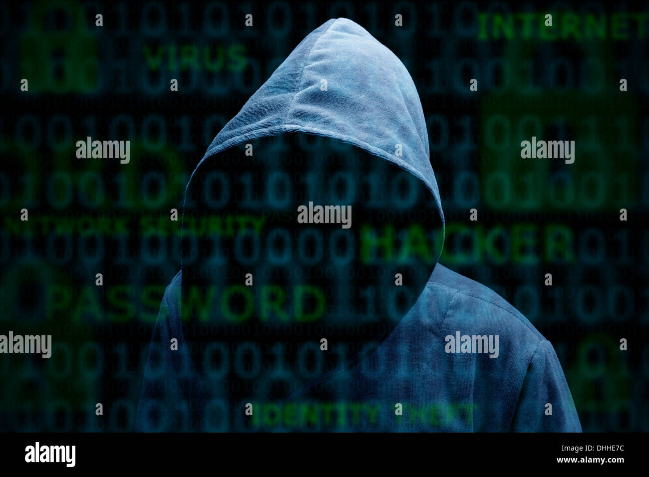 Silhouette à capuchon d'un hacker Banque D'Images