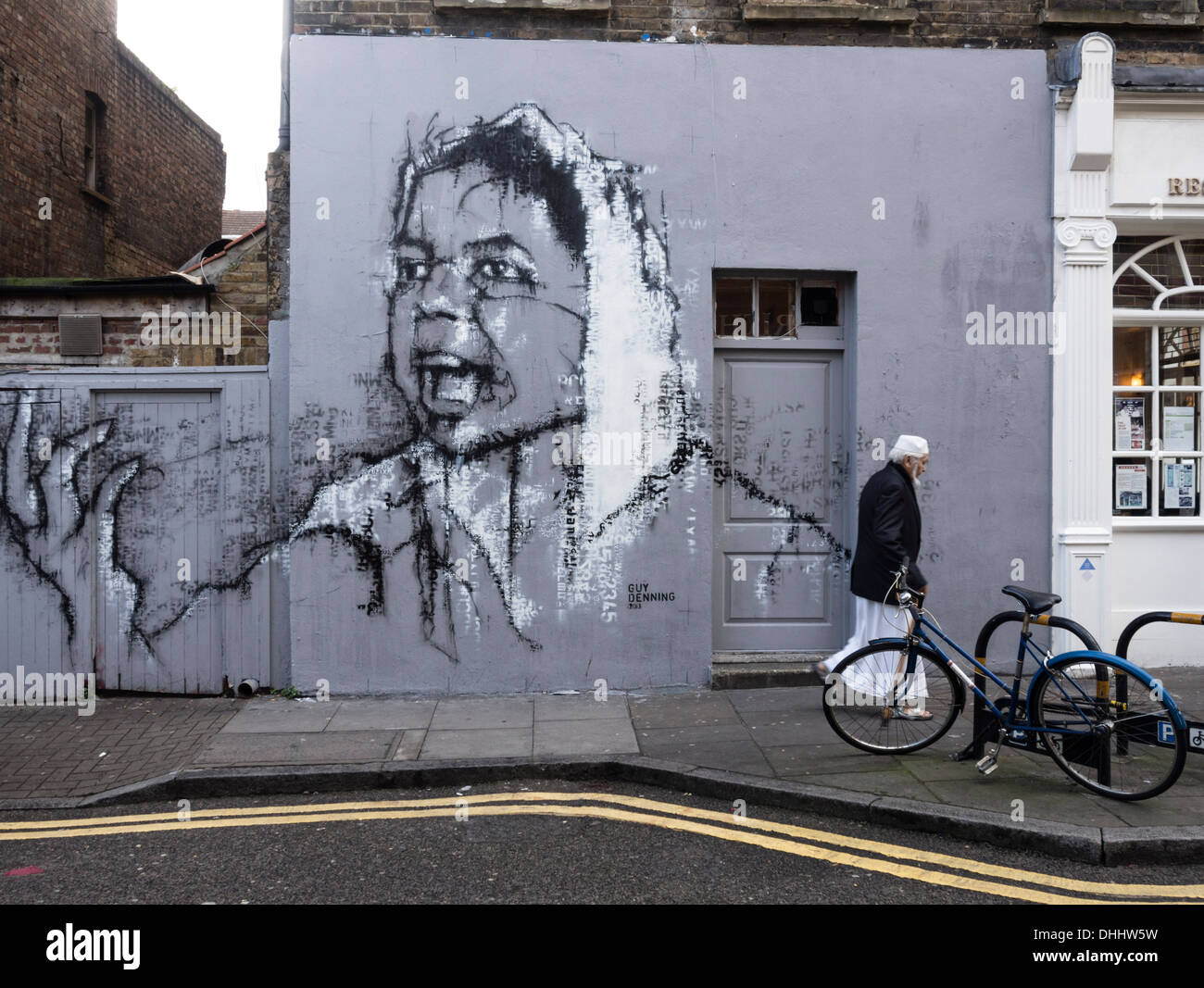 Street Art Par Guy Denning dans Hanbury Street, à côté de Brick Lane, London Banque D'Images